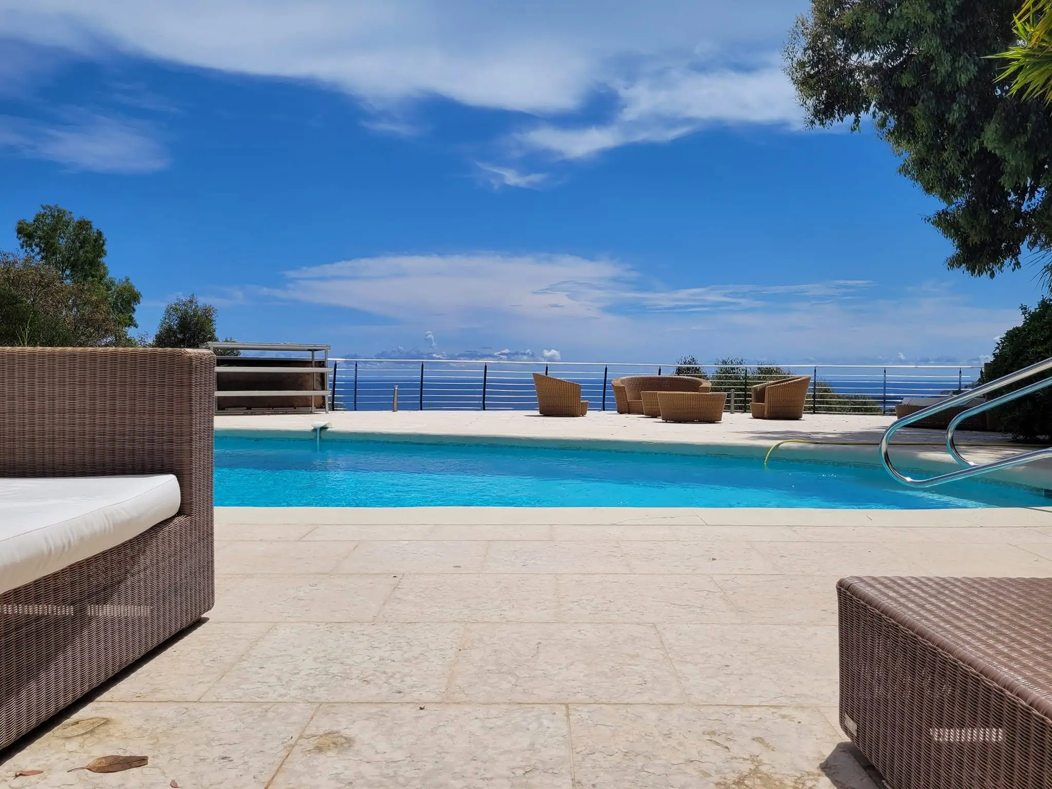 Pool terrace opening toward the Mediterranean horizon