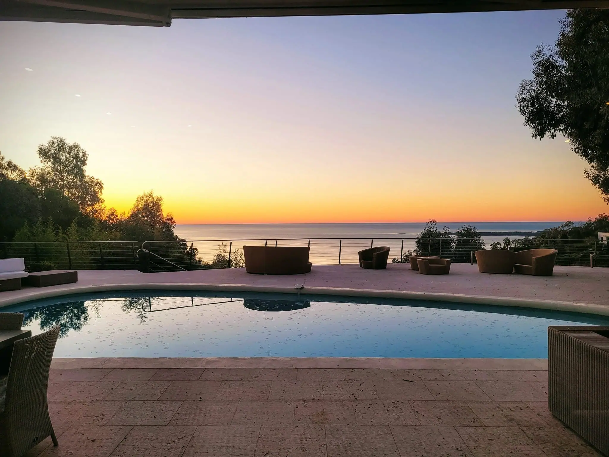 Sunset over the Mediterranean from the pool at Villa Oxygène