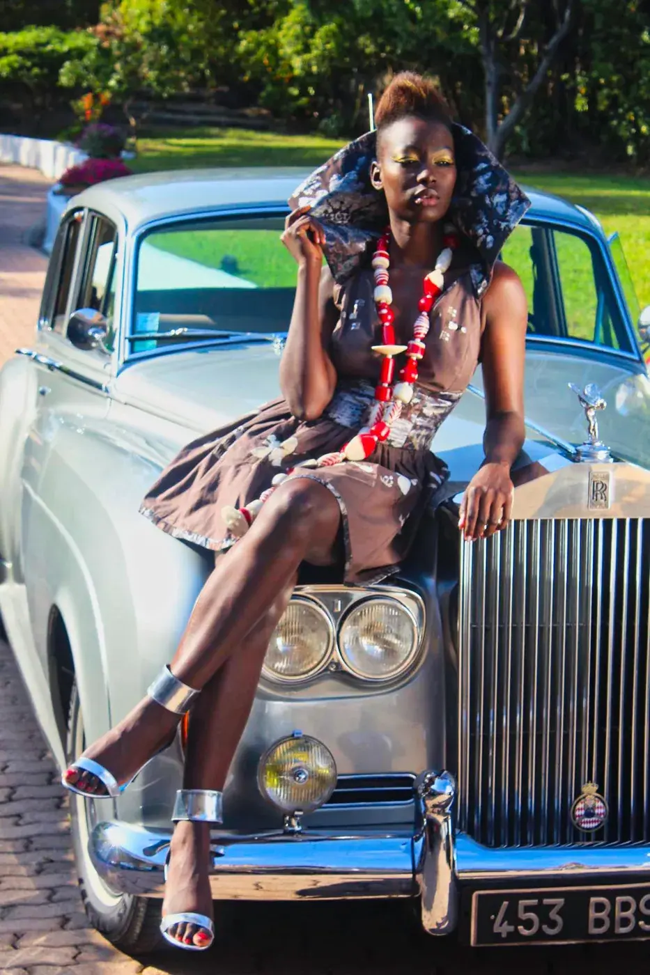 Fashion campaign photographed with a classic Rolls-Royce in the villa driveway