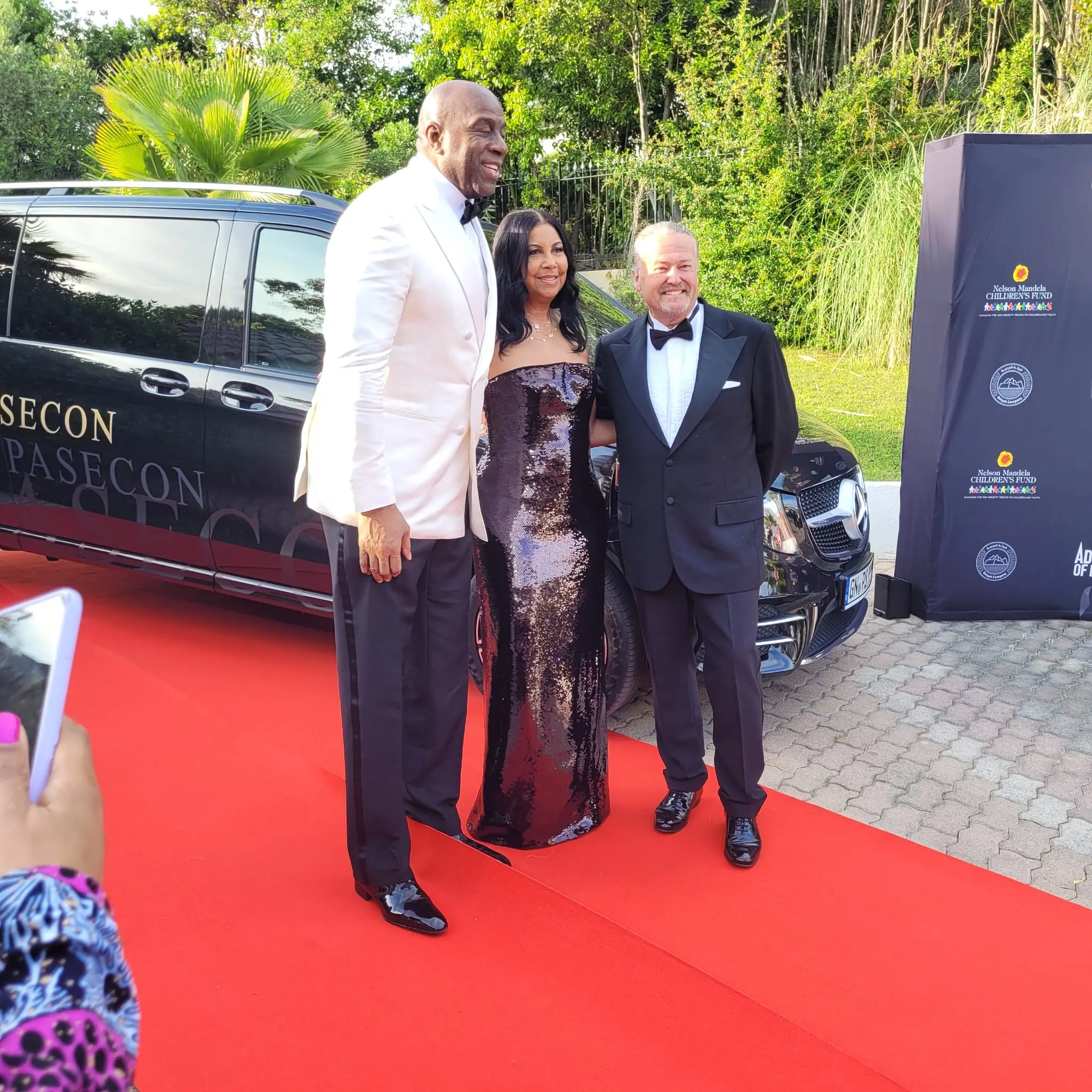 Magic Johnson and guests on the red carpet